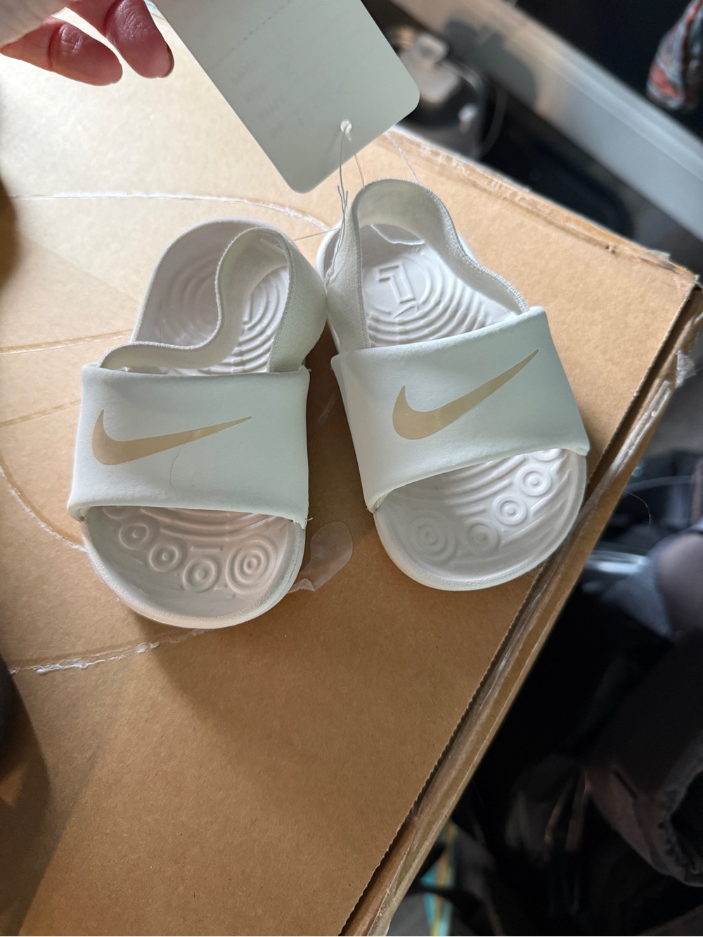 Nike Kids White Slide Sandals with Gold Swoosh